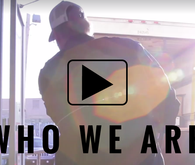 who we are video man loading box on truck