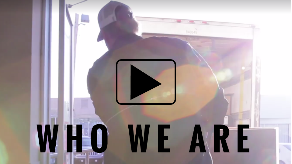 who we are video man loading box on truck